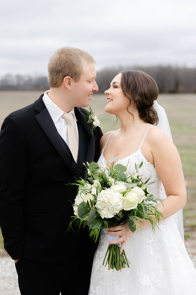bride and groom nuzzling together at Ritz Charles photographed by Kaitlin Mendoza Photography, a wedding photographer in Indianapolis