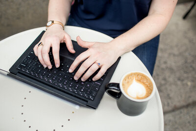 Hands on keyboard with coffee