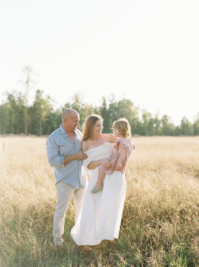 Family of 3 in a field