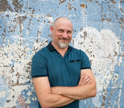 A small business owner poses for a personal branding headshot in Baltimore, Maryland.