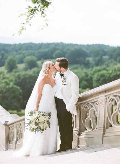 Bride and Groom Kissing on Biltmore Stairs Photo