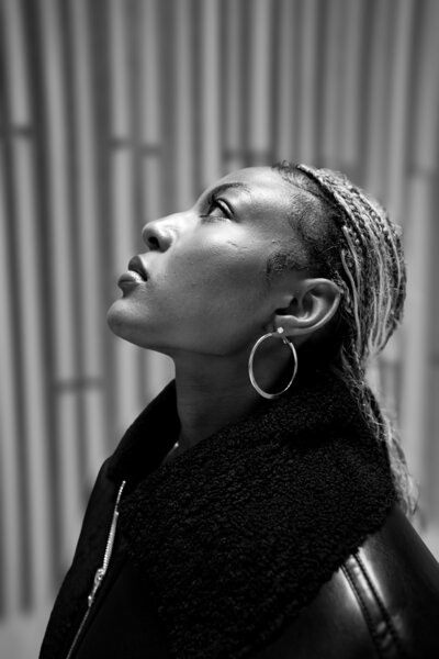 Black woman in black and white looking up