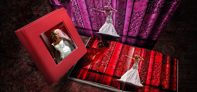 Styled photo that showcase a  red leather album with a crystal glance insert cover.