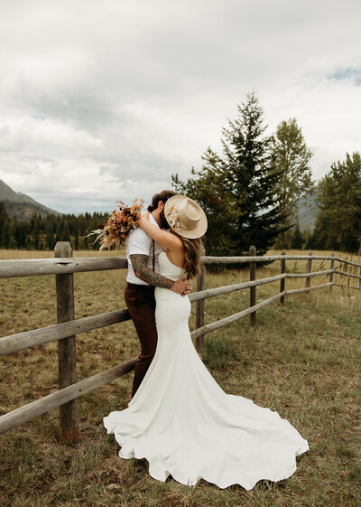 couple getting married in glacier national park by lake mcdonald