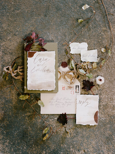 wedding invitation with earthy watercolor tones and abstract art for wedding at industrial warehouse in brooklyn nyc