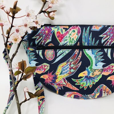 a handmade zipper pouch using Spoonflower petal signature cotton with apple blossoms
