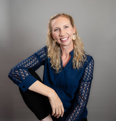 Ingrid-Berrios-smiles-while-walking-forwards-during-her-branding-photoshoot-in-Spring.