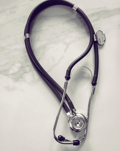 Stethoscope and clipboard setup at Wellness Pointe, symbolizing compassionate, proactive healthcare.