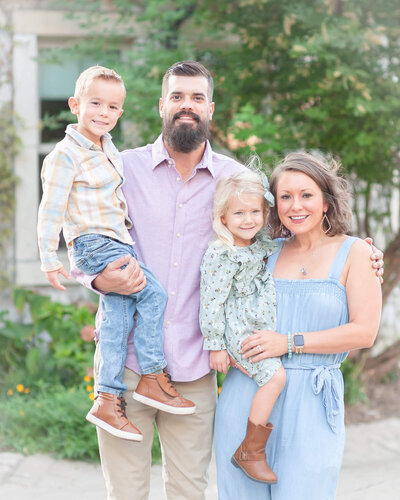 Gorgeous family with two small children in pastels in Mckinney Texas' Adriatica Village