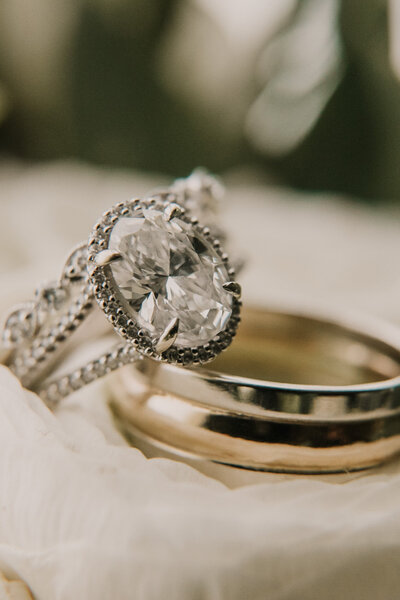 A Close up photo of a bride and groom's wedding rings taken by DK Hebert Photography