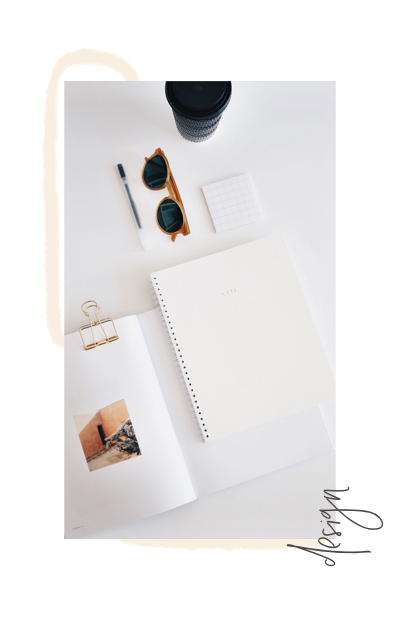 overhead view of notebook, coffee, sunglasses on desk