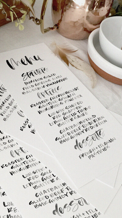 A watercolor calligraphy dinner wedding menu.