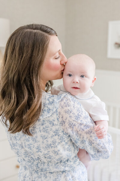 Mother kissing her baby. -greenville sc photographer
