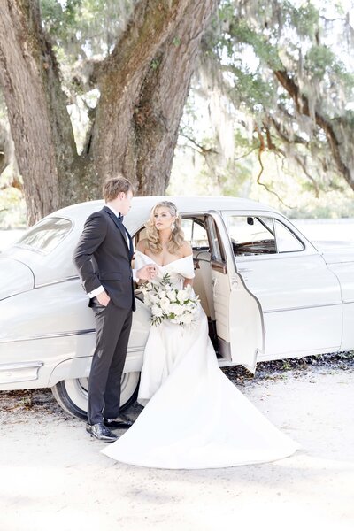 wedding couple with vintage car in Charleston South Carolina