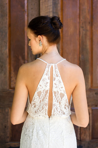 Link to more details and photos of the Sabine all-lace wedding dress with its unique racerback bodice.