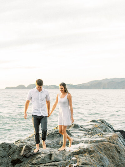 San Francisco wedding day bride and groom pose for portraits on the beach