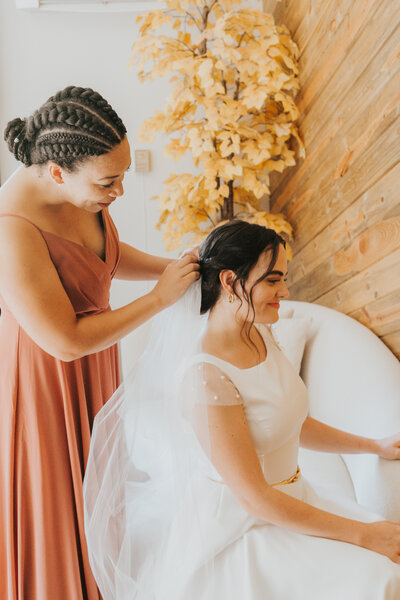 two sisters having a moment before the wedding by wedding planners in Denver