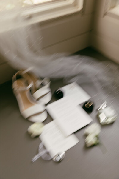 detail shots of wedding shoes invitations and perfume virginia wedding