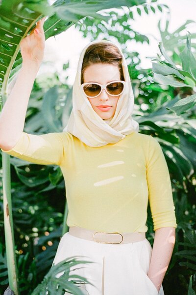 styled 50s fashion with headscarf and cat eye sunglasses