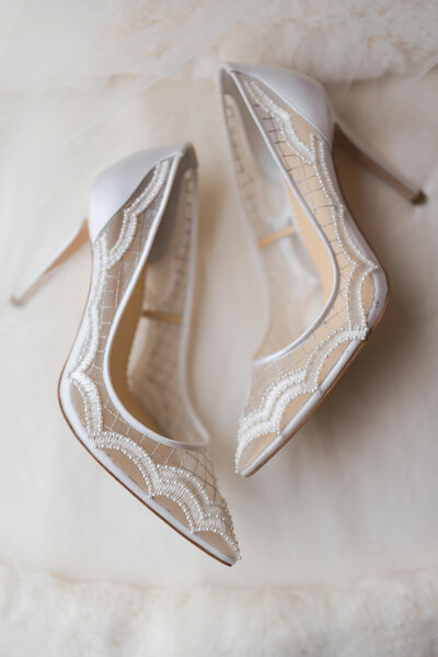 wedding shoes on a bed at Hotel Zaza in Houston Texas by Swish and Click Photography