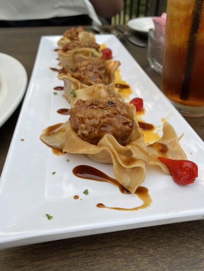 Chicken shumai appetizer displayed on a plate