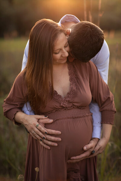 NJ Family photographer captures expecting couple kissing