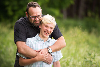 family photos in Ottawa showing a father hugging his son