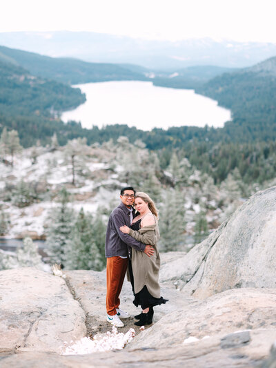 couple posing on overlook in lake tahoe for a lake tahoe engagement session