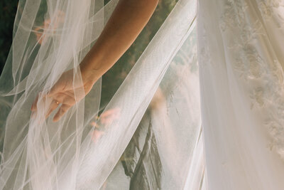 bride's hand in veil