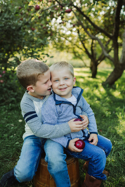 boys in apple orchard