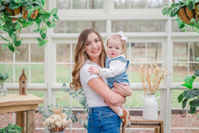Mom embraces toddler girl in Atlanta Family Photography session.