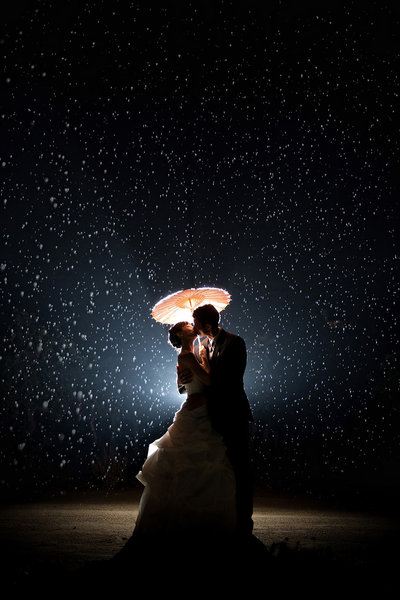 Incredible night photography with a couple in rain at a winery taken by ABM Photography