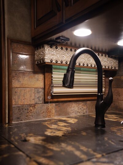 Close up of a faucet inside a luxury horse trailer