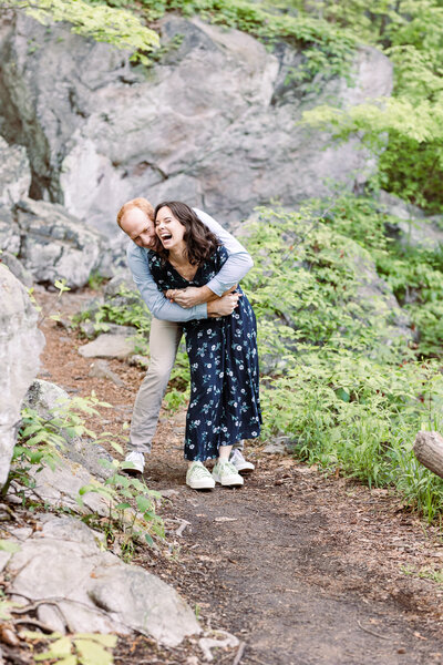 couple hugging and laughing at Glen Falls