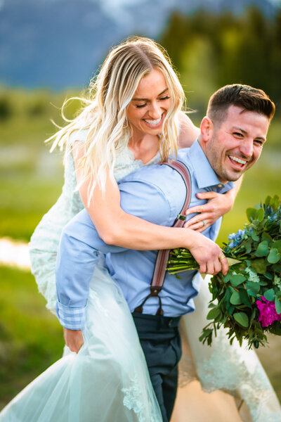 Jackson Hole photographer captures bride and groom laughing together after Grand Teton wedding