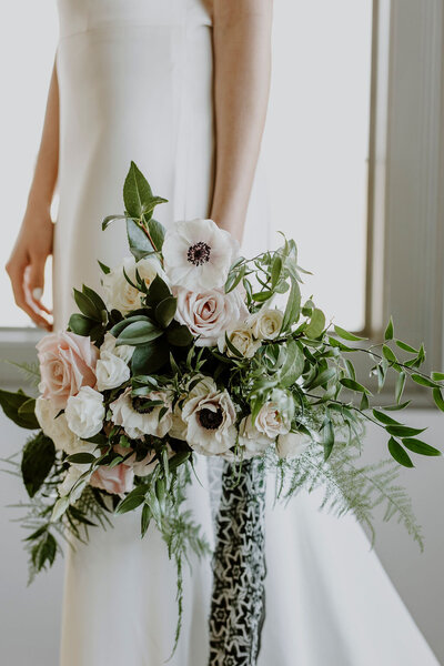 Elegant white and pink bridal bouquet by Hen & Chicks, classic Calgary, Alberta wedding florist, featured on the Brontë Bride Vendor Guide.