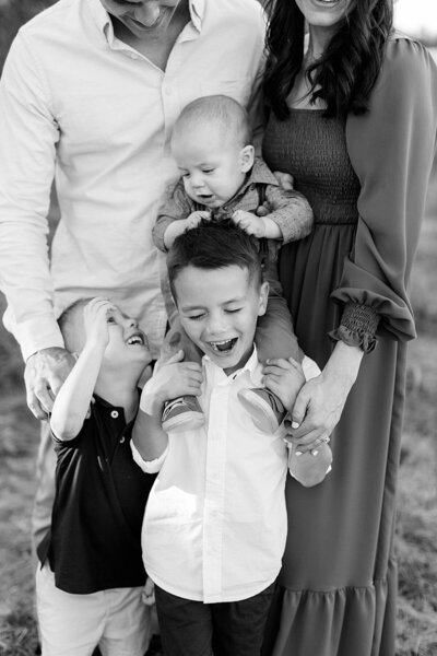 Indianapolis family photographer, Katelyn Ng Photography, photographed three young boys and their parents outdoors.