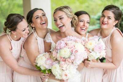 Bridesmaids laughing at Hillendale Country Club wedding