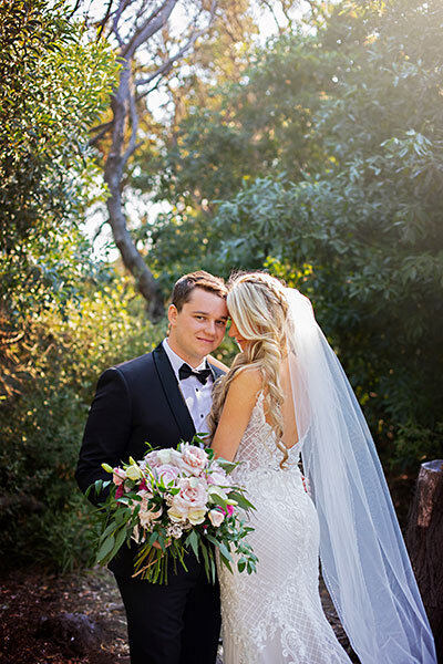 bride and groom embracing in nelson bay n bay wedding