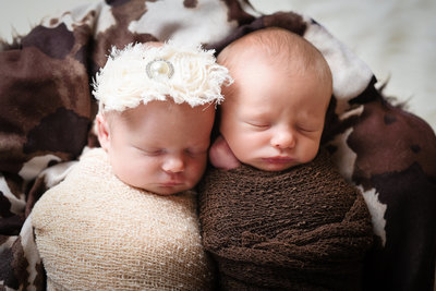 Beautiful Mississippi Newborn Photography:  Twin boy and girl snuggle and sleep
