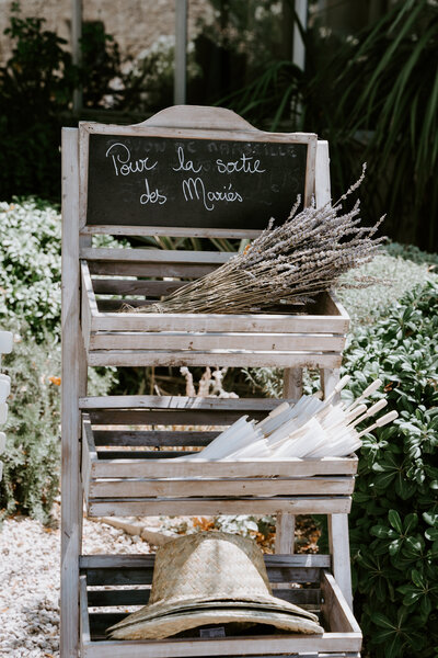 Sun hats, umbrellas, and lavender favors for wedding guests on the French Riviera