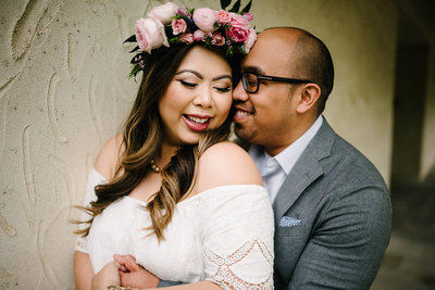 a couple with flowe crown cuddles up at the new jersey botanical gardens and skylands manor