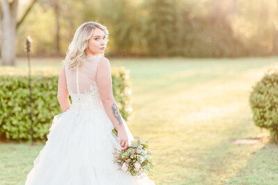 A photo of a bride at sunset for her wedding at Englund Estate in Cuthbert Georgia by Jennifer Marie Studios.