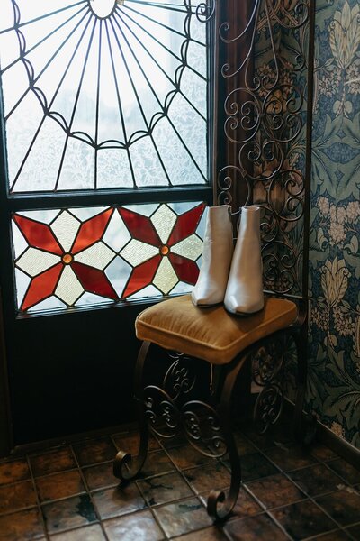 Detail Shot of Shoes in Front of Stain glass Window - Megan & Amber | Hood River Wedding  - LGBTQ Wedding