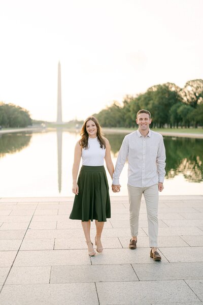 Bride and Groom walking in front of the reflecting pond at Lincoln Memorial in Washington DC