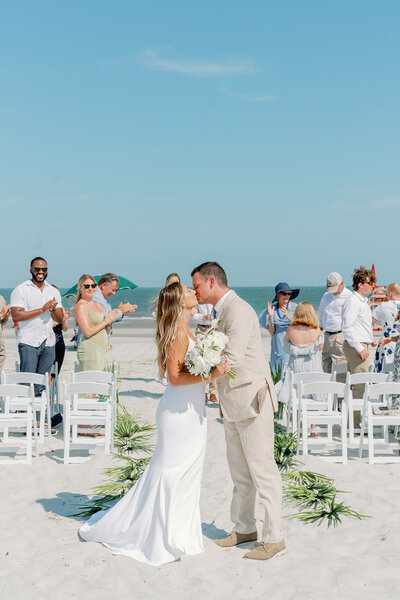 Bride and groom kissing after their outdoor beach ceremony in Hilton Head