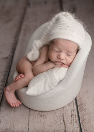Bend Newborn Photographer, newborn in cream chair