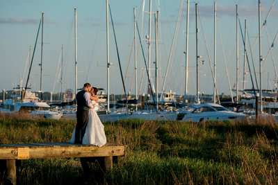 bride and groom on docks at the historic rice mill