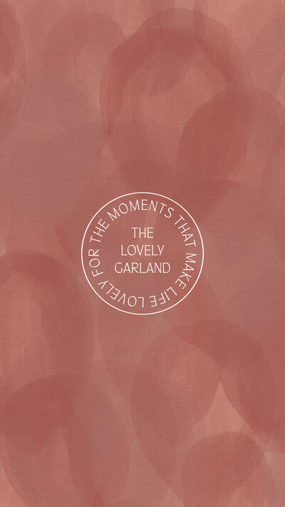 The Lovely Garland stamp logo on a pink balloon texture background