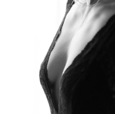 Stunning black and white image subtly showing a woman's upper body curves